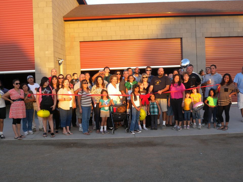 Friends, family and customers celebrate the grand opening of Laveen Auto Works in October 2008.